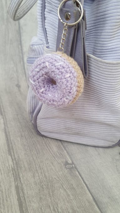 a keyring crocheted to look like a mini donut